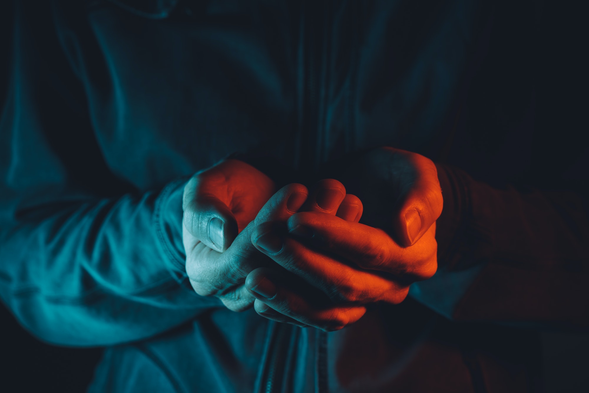 Empty cupped male hands pleading and begging