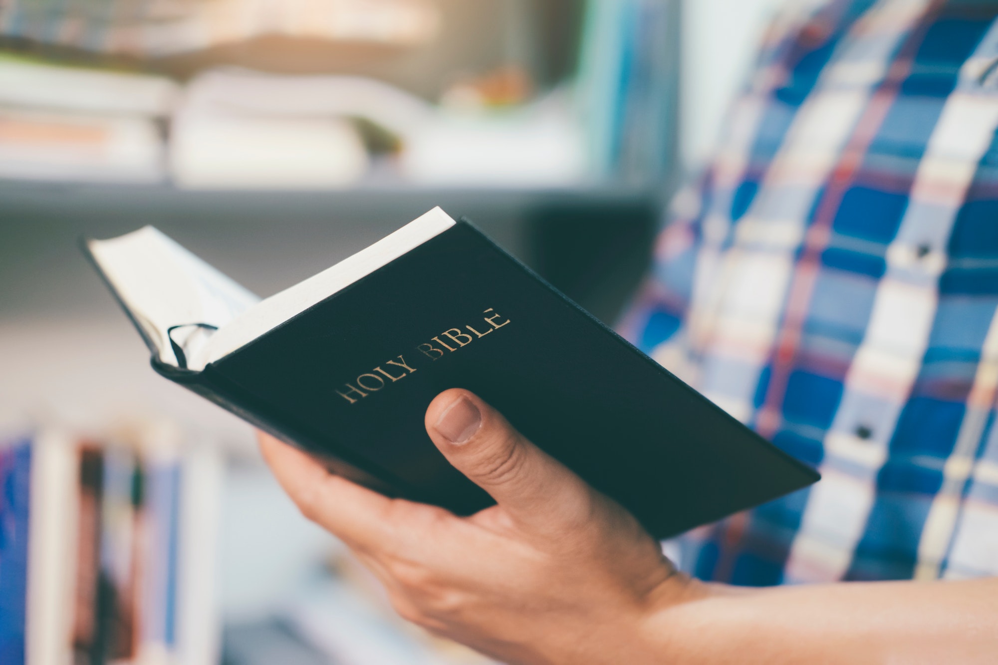 Man reading holy bible.