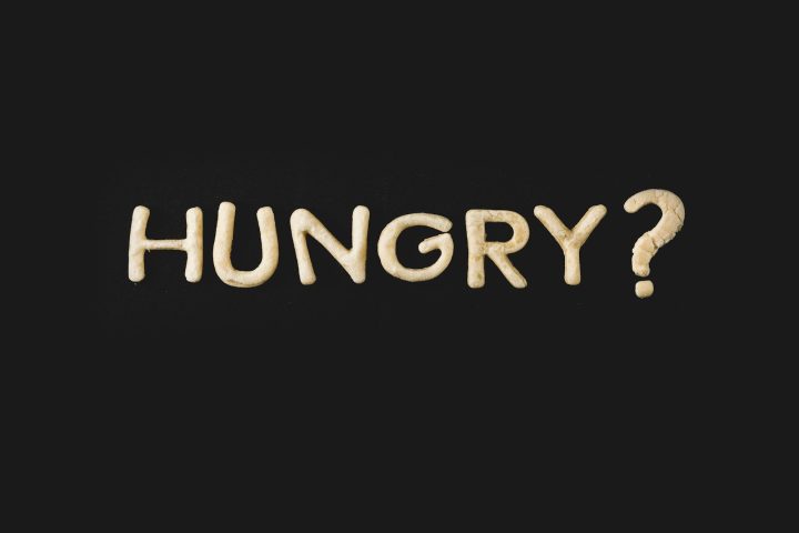 top view of word hungry made from cookie dough isolated on black